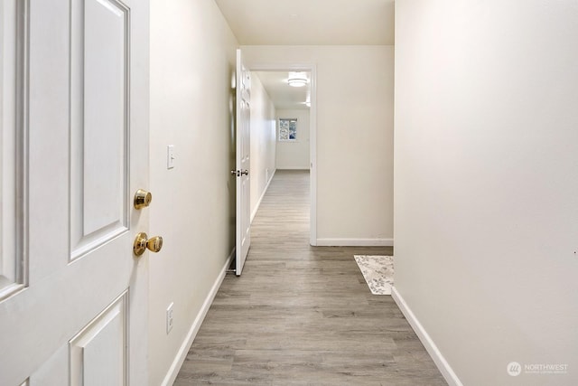 corridor featuring light hardwood / wood-style floors