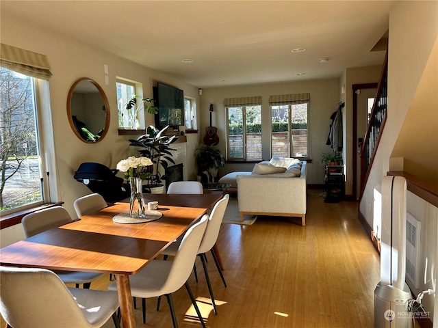 dining space featuring light wood-type flooring