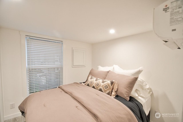 bedroom with a wall mounted air conditioner