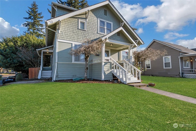 view of front facade featuring a front lawn and covered porch