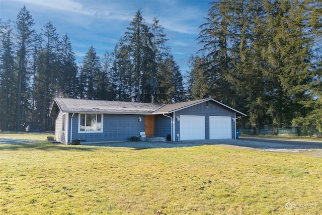 ranch-style home featuring a garage and a front yard