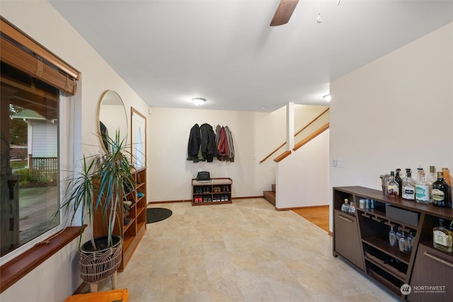 foyer featuring ceiling fan