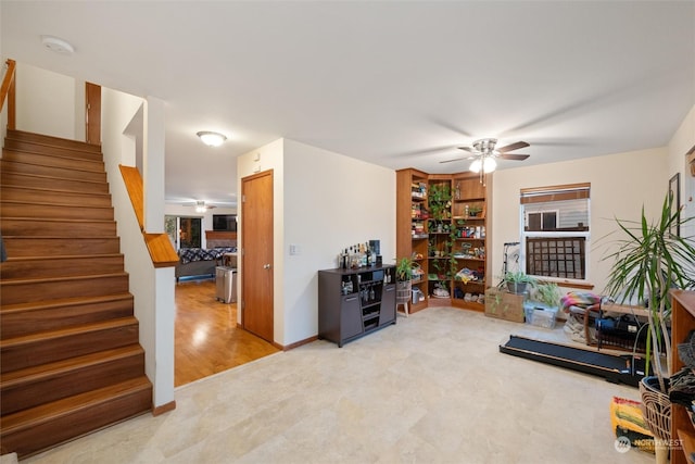 interior space with ceiling fan