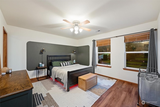 bedroom featuring wood-type flooring and ceiling fan