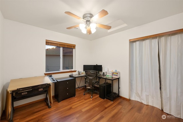 office with hardwood / wood-style flooring and ceiling fan