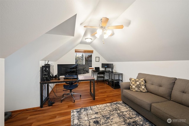 home office featuring wood-type flooring, vaulted ceiling, and ceiling fan