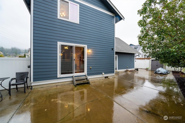 rear view of property featuring a patio