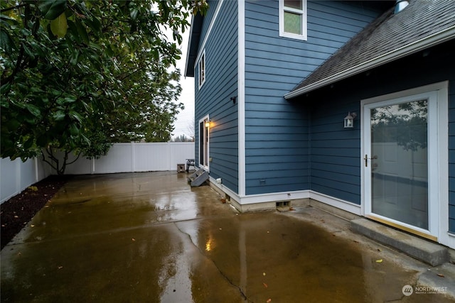 view of side of property featuring a patio area