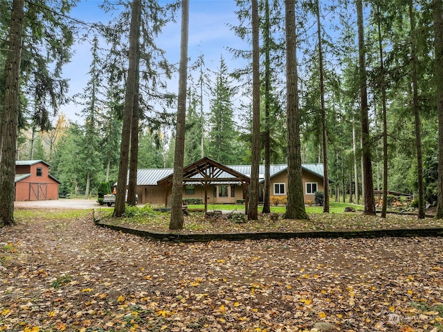 view of front of house with an outbuilding