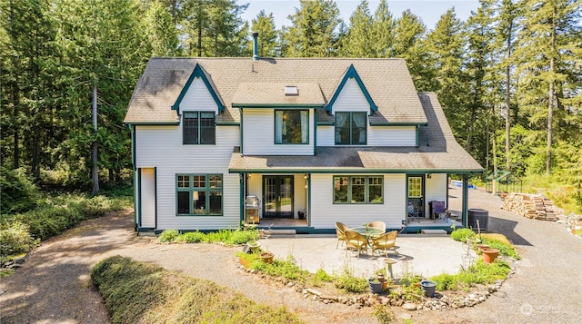 view of front of home featuring central AC unit and a patio