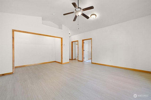 empty room with vaulted ceiling, ceiling fan, and light wood-type flooring