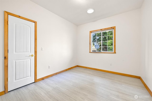 spare room with light wood-type flooring