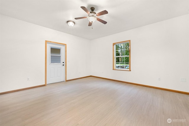 empty room featuring ceiling fan and light wood-type flooring