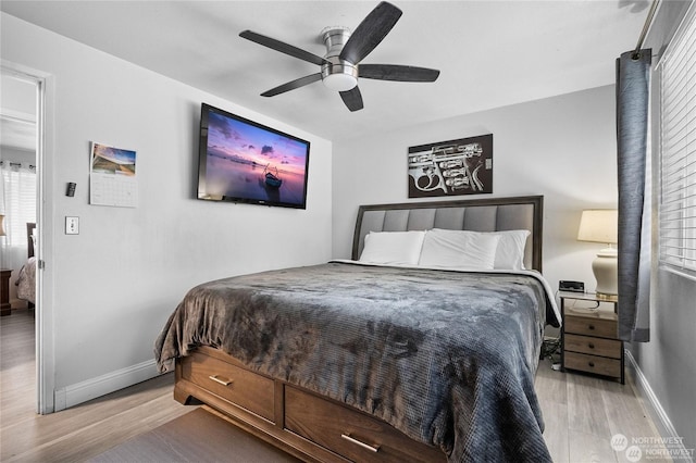 bedroom featuring ceiling fan and light wood-type flooring