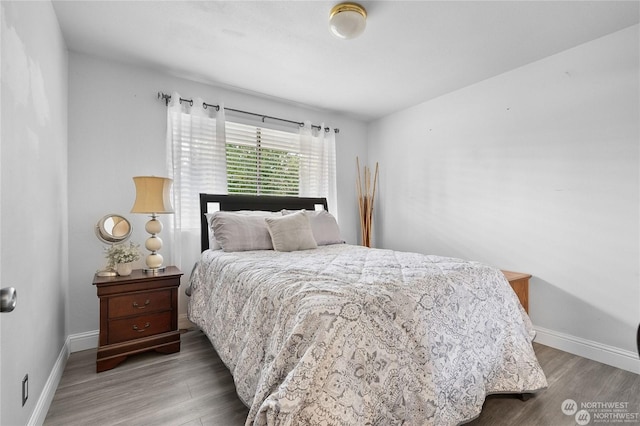 bedroom featuring hardwood / wood-style flooring