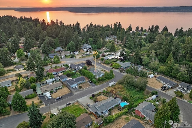 aerial view at dusk with a water view