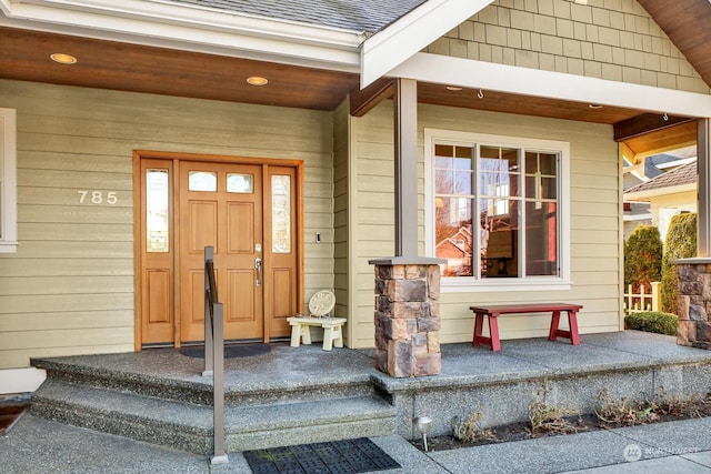 entrance to property featuring a porch