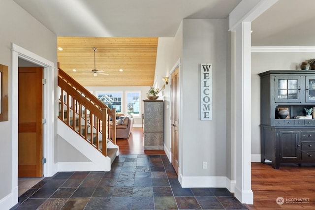 entryway featuring ceiling fan and wooden ceiling