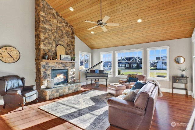 living room featuring a stone fireplace, wood-type flooring, high vaulted ceiling, wooden ceiling, and ceiling fan