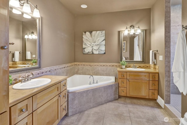 bathroom with vanity, independent shower and bath, and tile patterned flooring