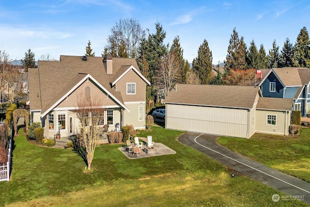 view of front of house featuring a patio area and a front lawn