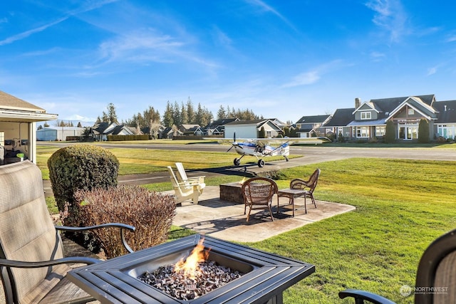 view of yard featuring a patio area and a fire pit