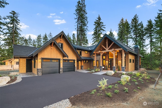 view of front of home featuring a garage and covered porch