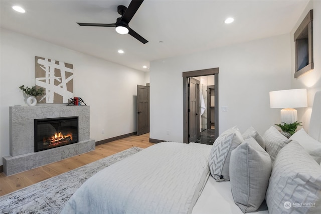 bedroom with ceiling fan and light wood-type flooring