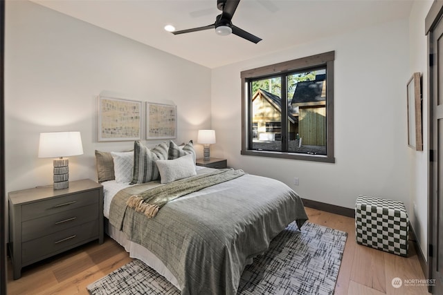 bedroom featuring ceiling fan and light hardwood / wood-style flooring