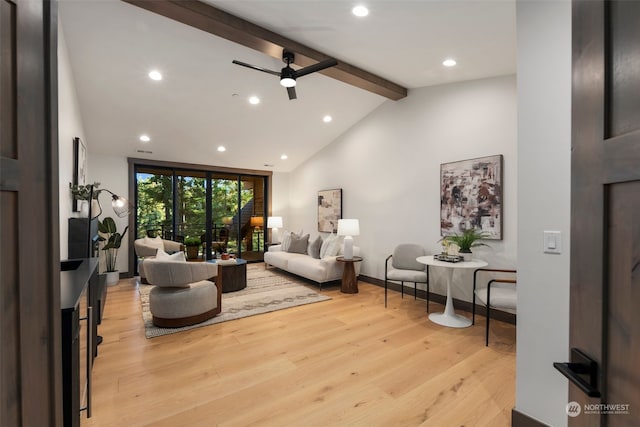 living room featuring vaulted ceiling with beams, ceiling fan, and light wood-type flooring