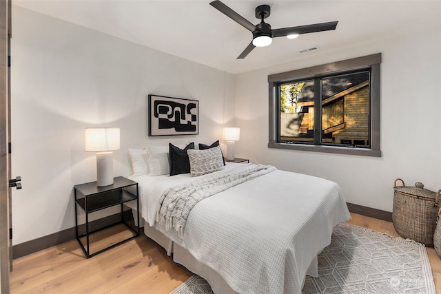 bedroom featuring ceiling fan and light hardwood / wood-style floors