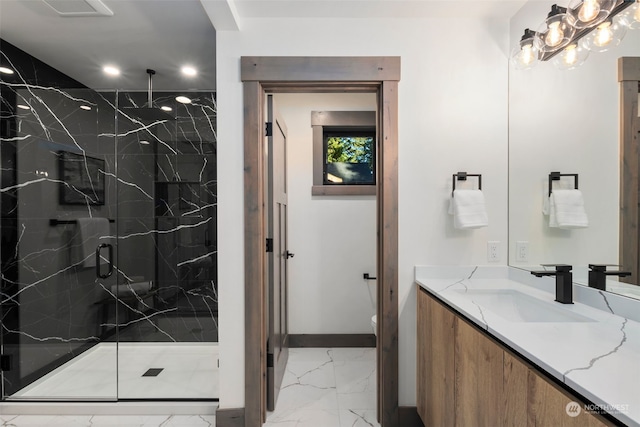 bathroom with vanity, a shower with shower door, and toilet