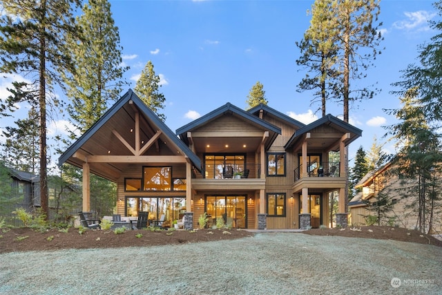 craftsman-style home with a balcony