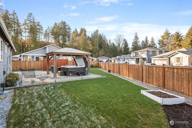 view of yard with a gazebo, a hot tub, and a patio area