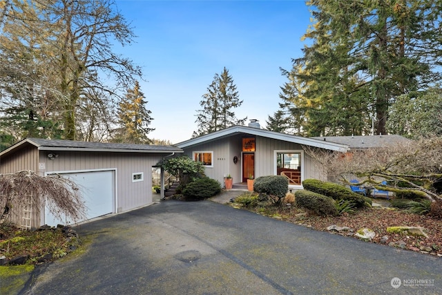 ranch-style house featuring a garage