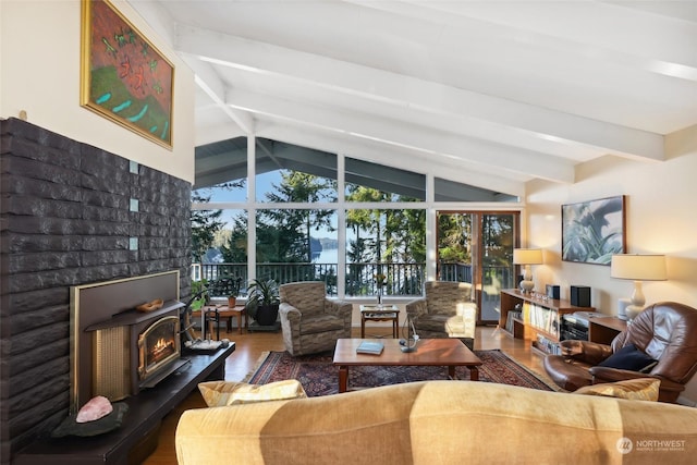 living room featuring hardwood / wood-style floors and lofted ceiling with beams