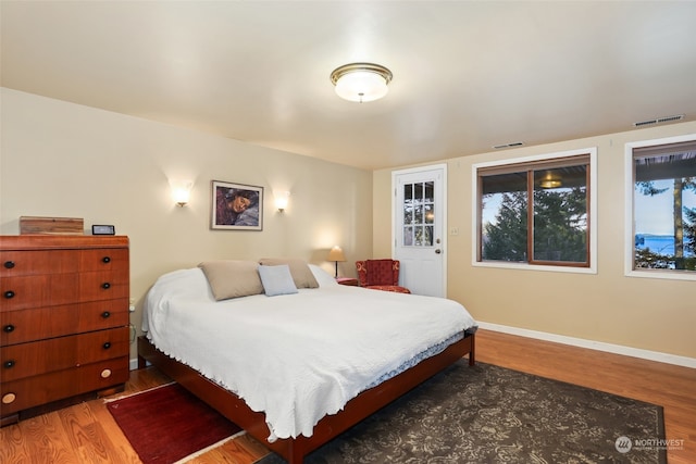 bedroom featuring dark hardwood / wood-style flooring