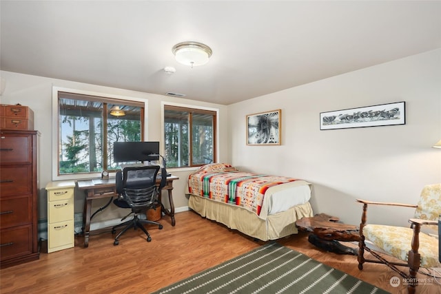 bedroom with light hardwood / wood-style flooring