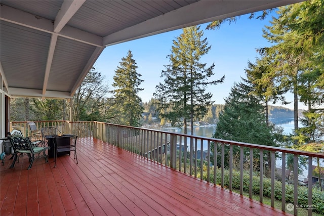 deck featuring a water view