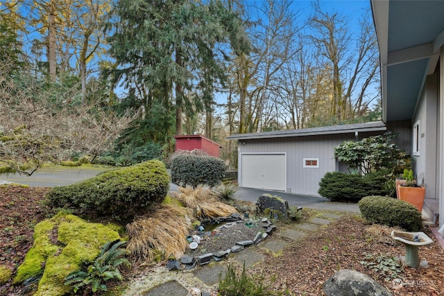 view of yard with a garage