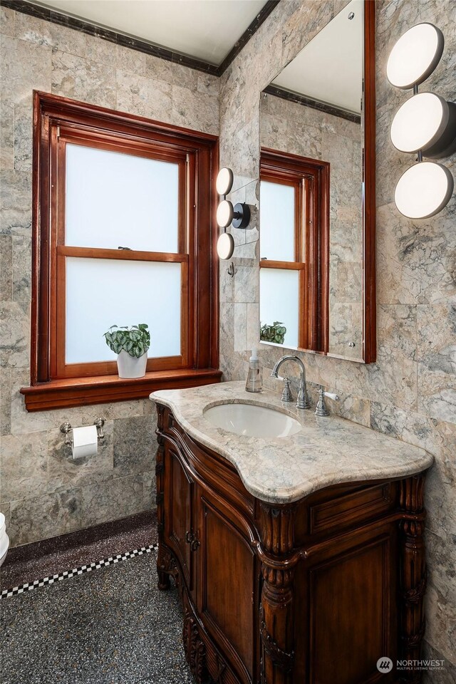 bathroom featuring vanity and crown molding