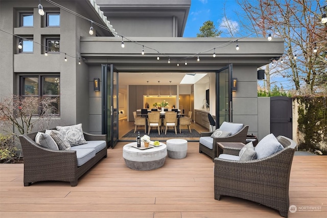 wooden deck featuring outdoor lounge area