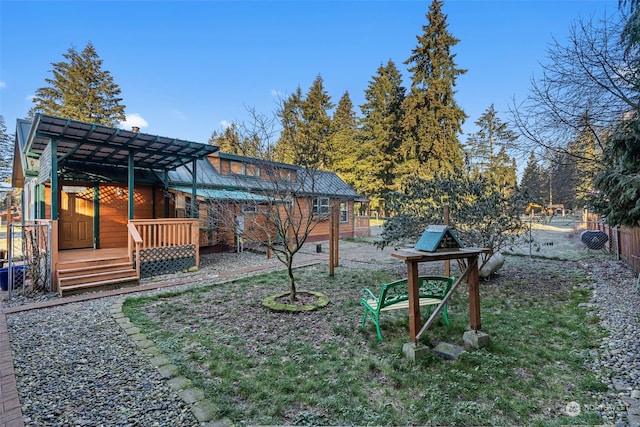 view of yard featuring a wooden deck and a pergola