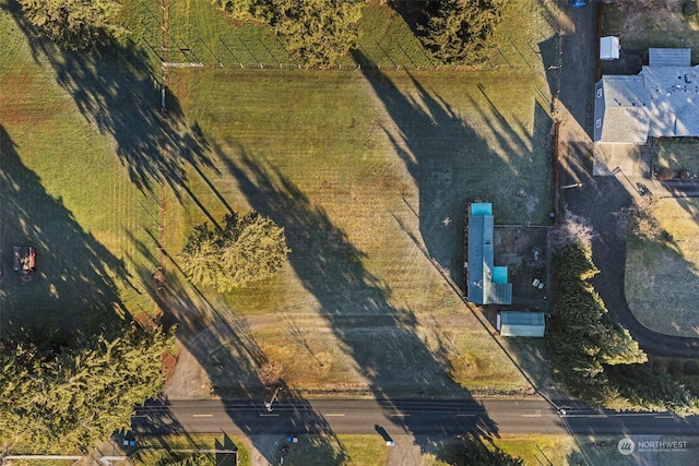 birds eye view of property with a rural view