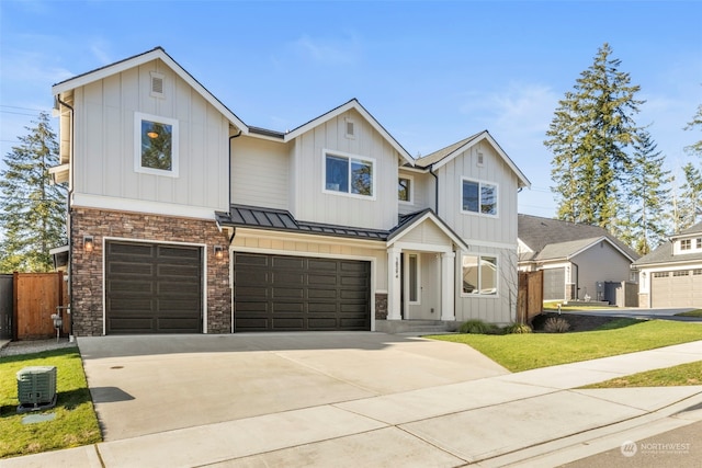 view of front of property with a garage and a front yard