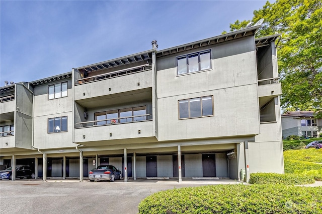 view of property featuring covered parking