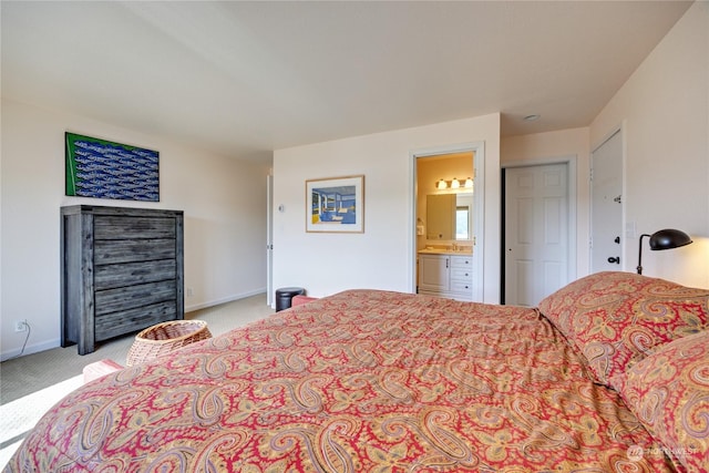 bedroom with light carpet, connected bathroom, and baseboards