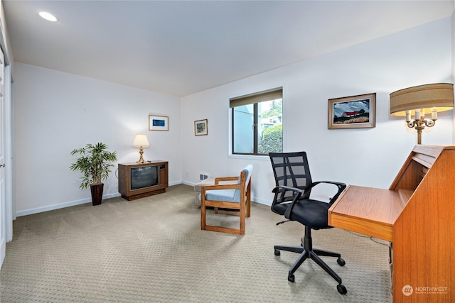 carpeted office featuring baseboards