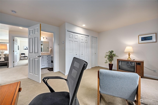 office featuring light carpet, recessed lighting, and baseboards