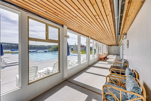 sunroom / solarium featuring wooden ceiling